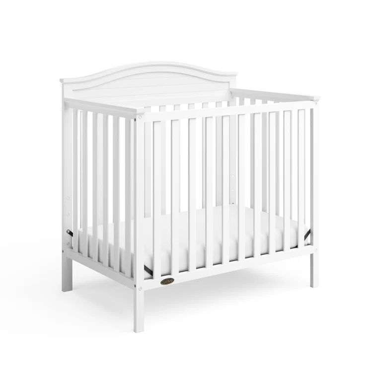 Stella White Pine Wood 4-in-1 Convertible Mini Crib with Foam Mattress