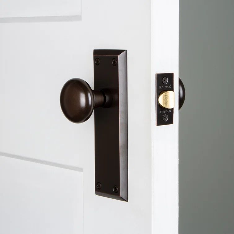 Timeless Bronze Universal Passage Door Knob with Plate