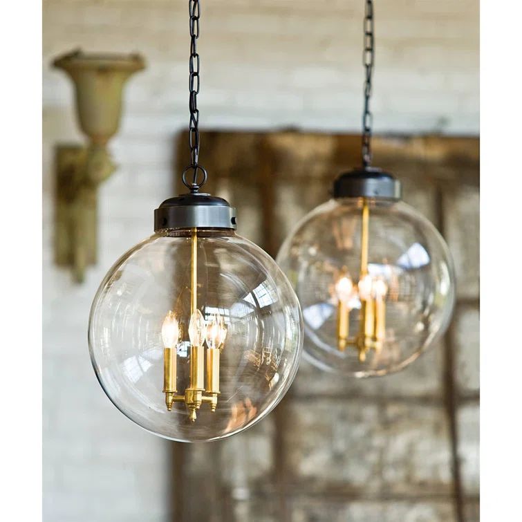 Clear Glass Globe Pendant with Oil Rubbed Bronze and Brass Finish