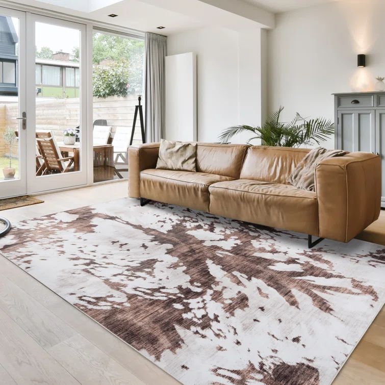 Ivory and Brown Synthetic Tufted Washable 5' x 7' Area Rug