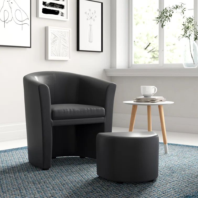 Sleek Black Barrel Faux Leather Armchair with Self-Storage Ottoman