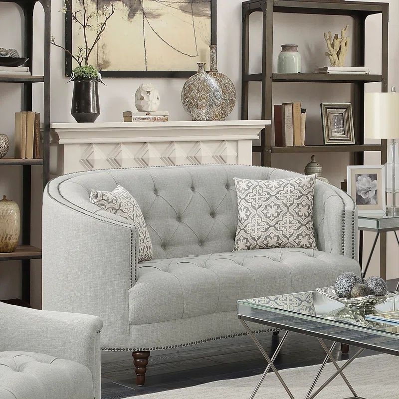 Beige Tufted Fabric Loveseat with Nailhead Trim and Wood Legs