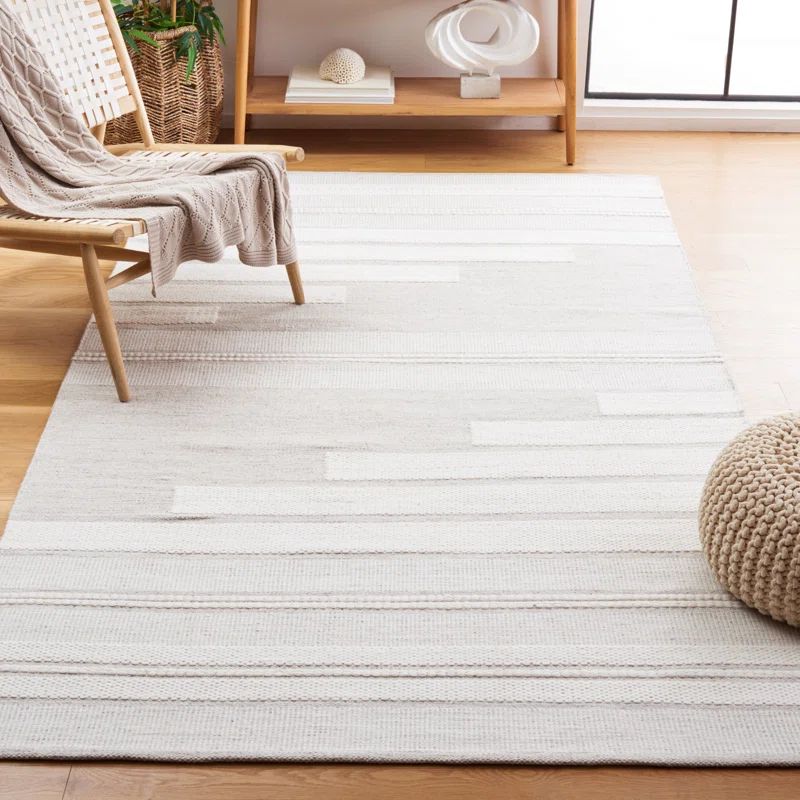Ivory and Beige Hand Woven Synthetic 5' x 8' Area Rug