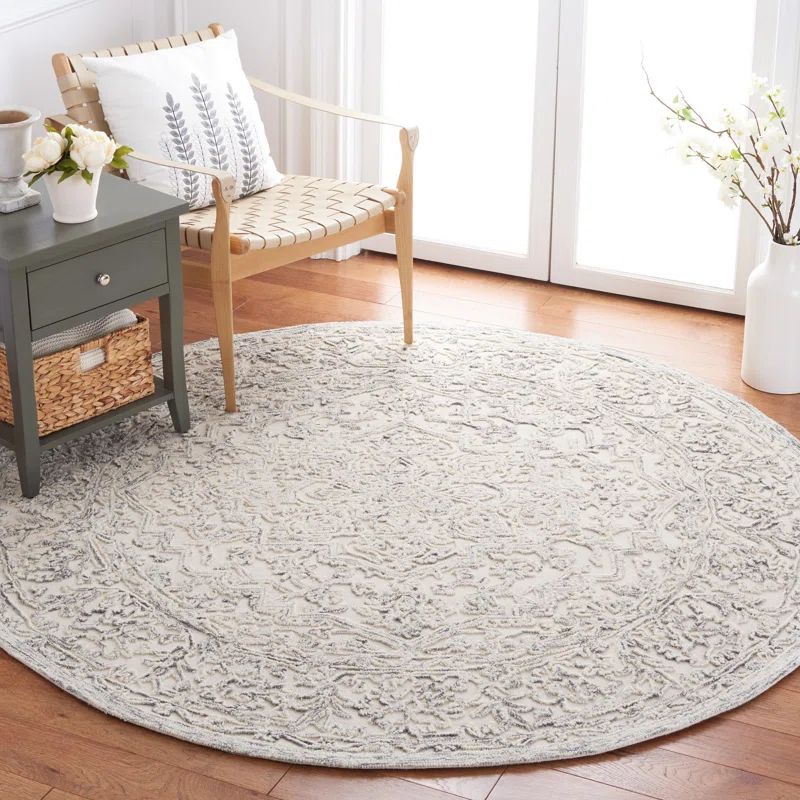 Handmade Ivory and Charcoal Round Tufted Wool Area Rug