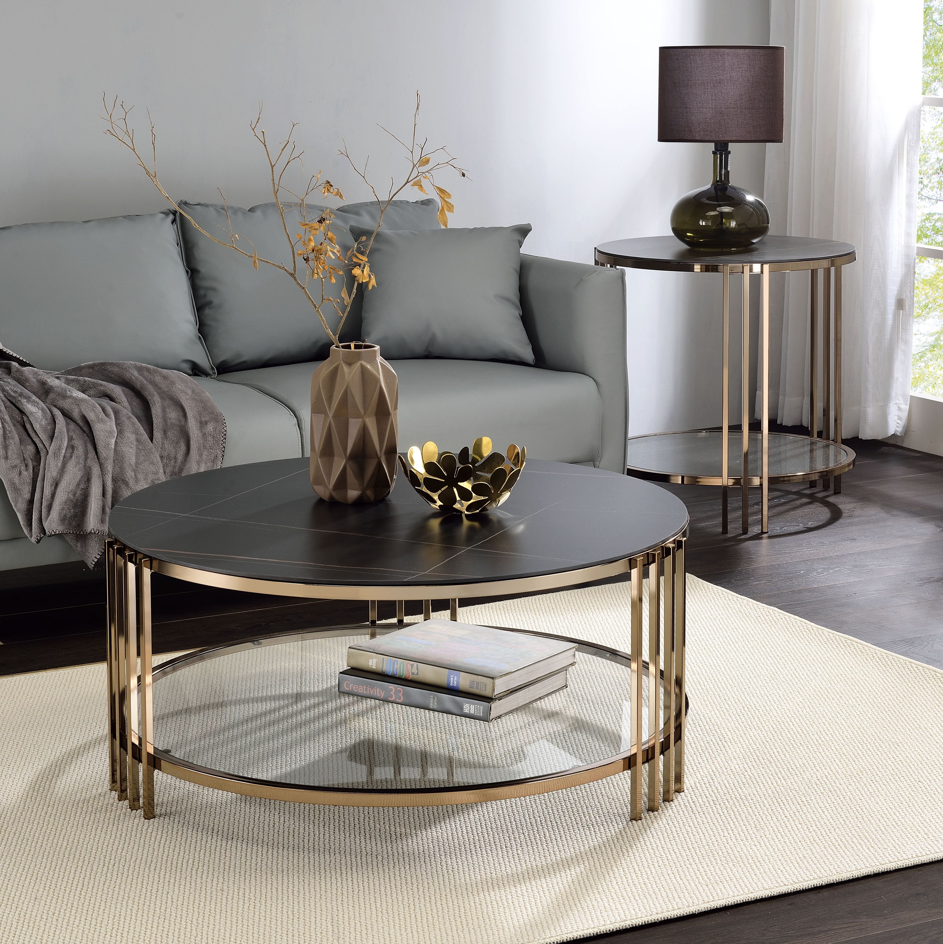 Round Black Sintered Stone and Glass Coffee Table with Champagne Finish