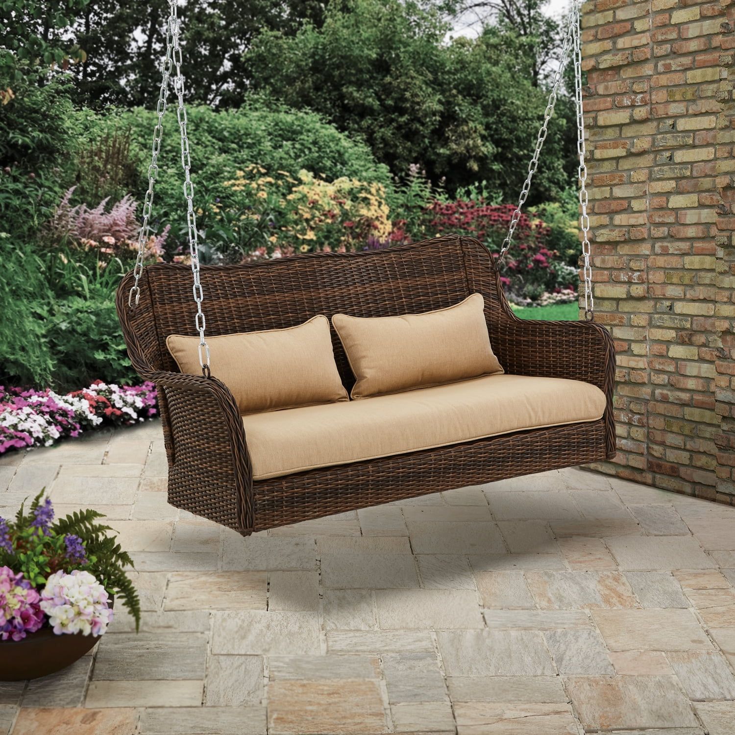 Brown Wicker Hanging Porch Swing with Tan Cushions