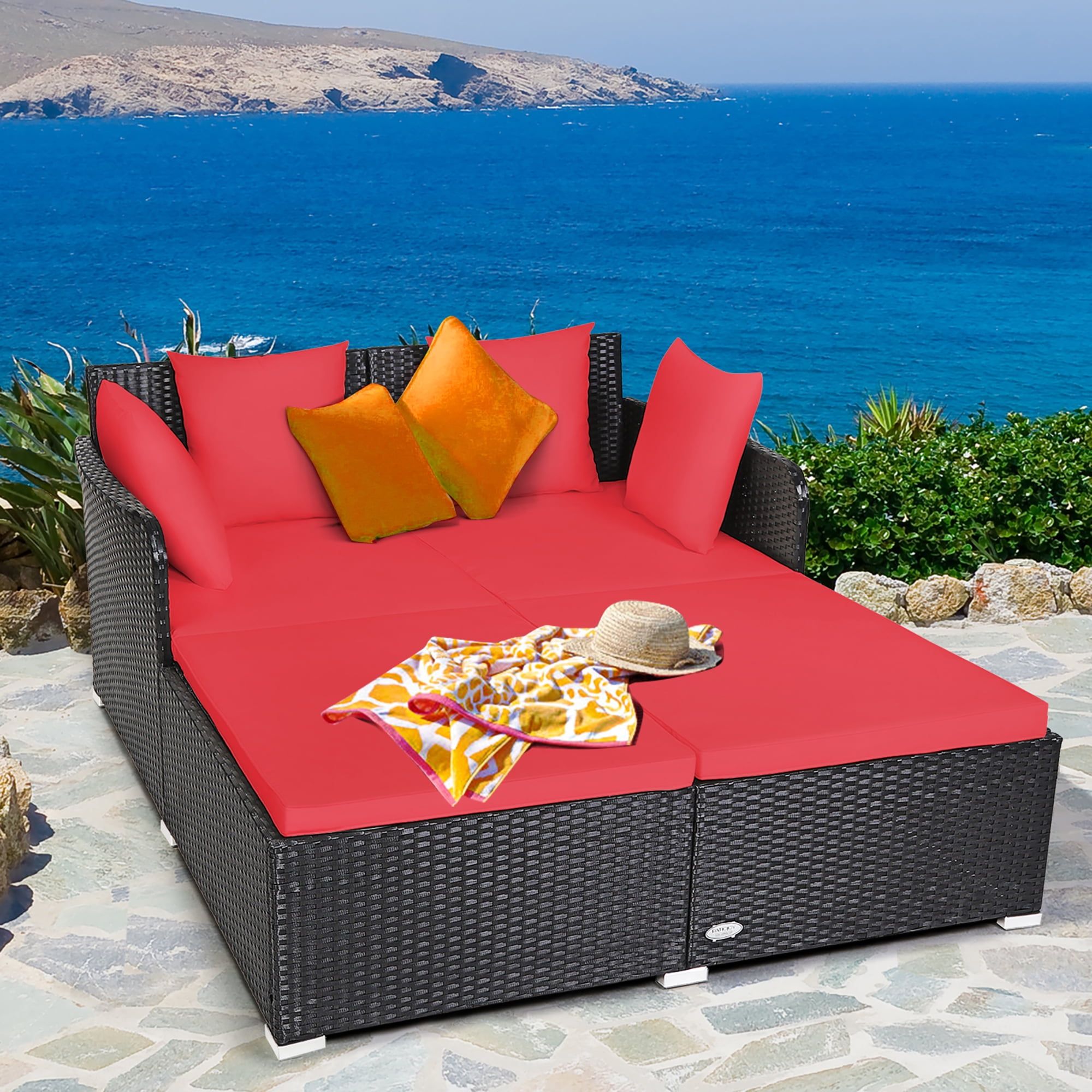 Outdoor Black Rattan Daybed with Red Cushions and Pillows