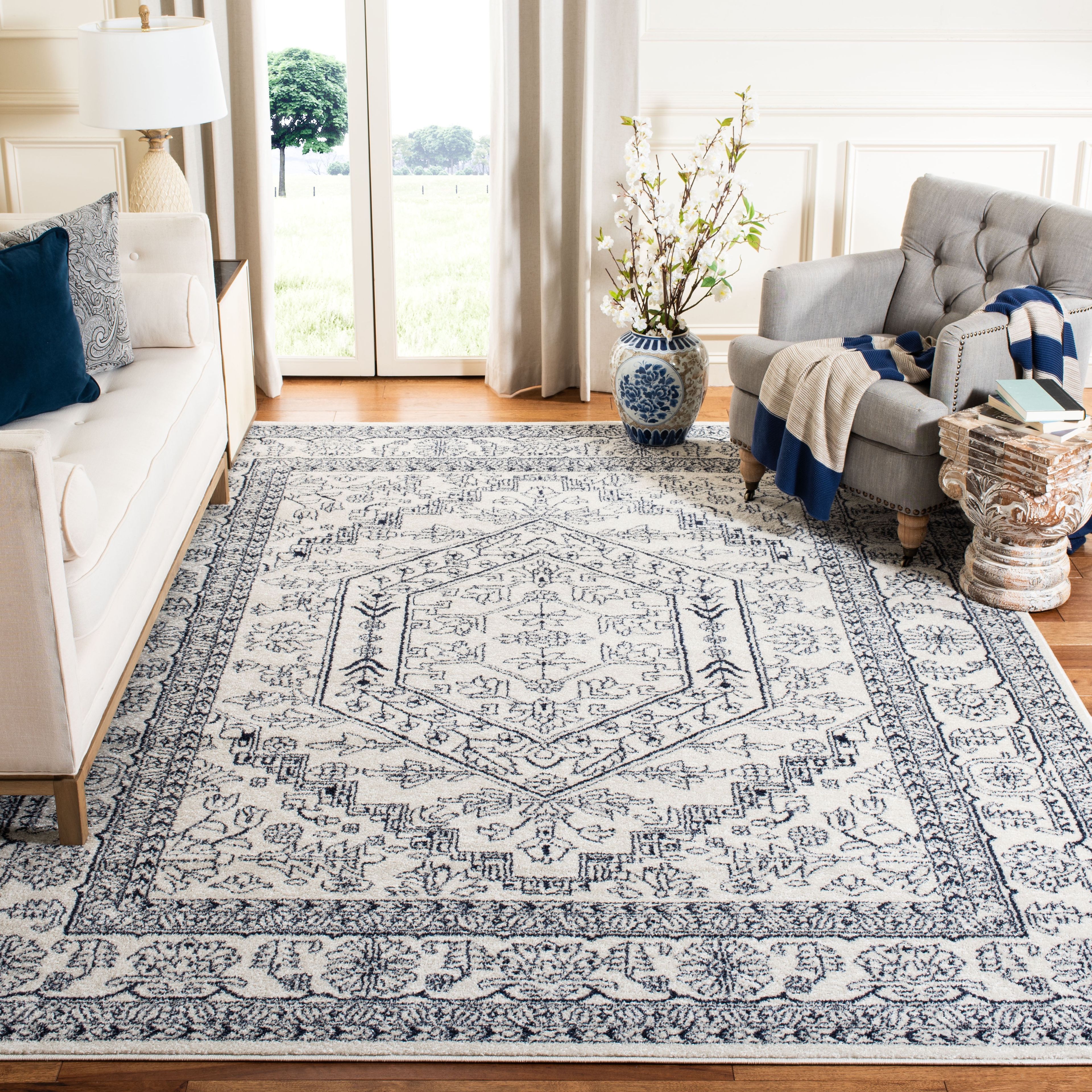 Ivory and Navy Synthetic 9' x 12' Washable Area Rug