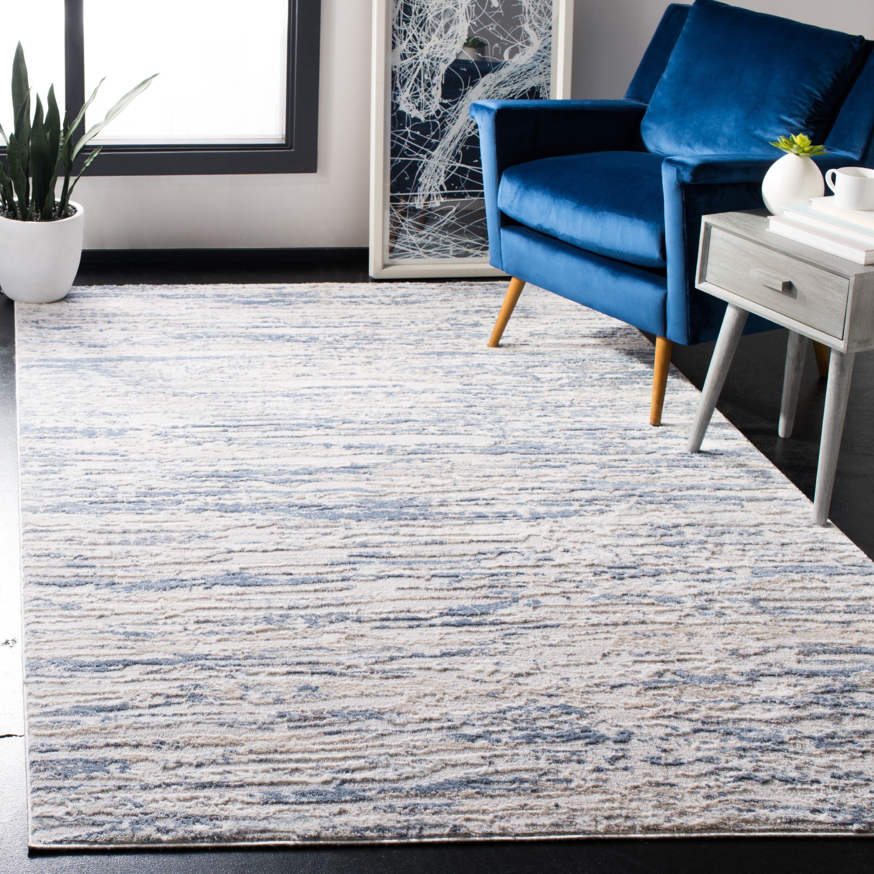 Ivory and Blue Abstract 8' x 10' Stain-Resistant Area Rug