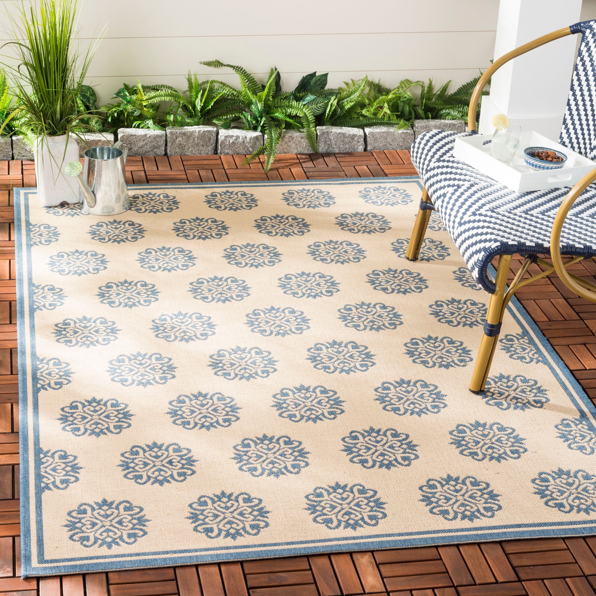 Cream and Blue Geometric Tufted 8' x 10' Synthetic Rug