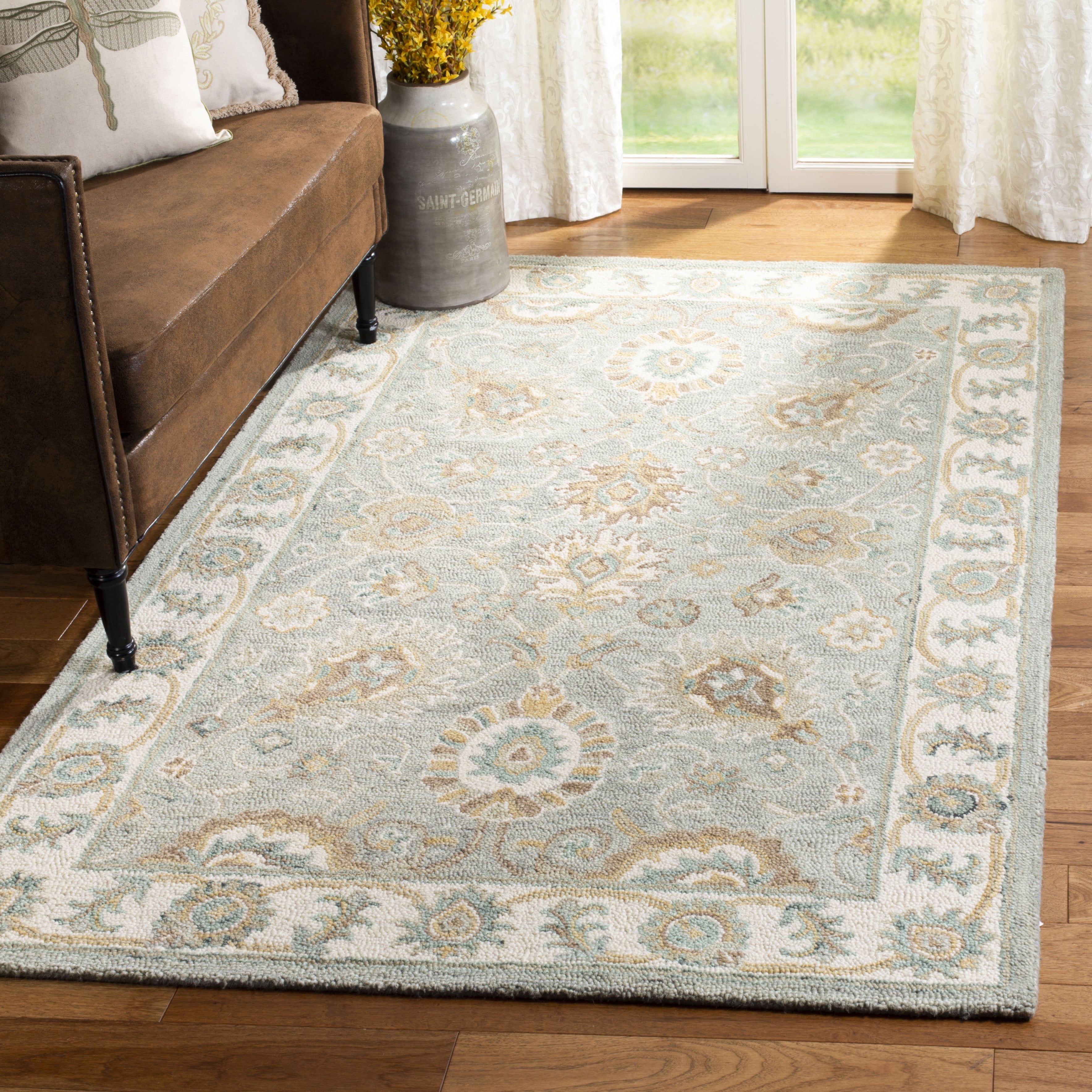 Handmade Ivory and Aqua Floral Wool Area Rug 5' x 8'