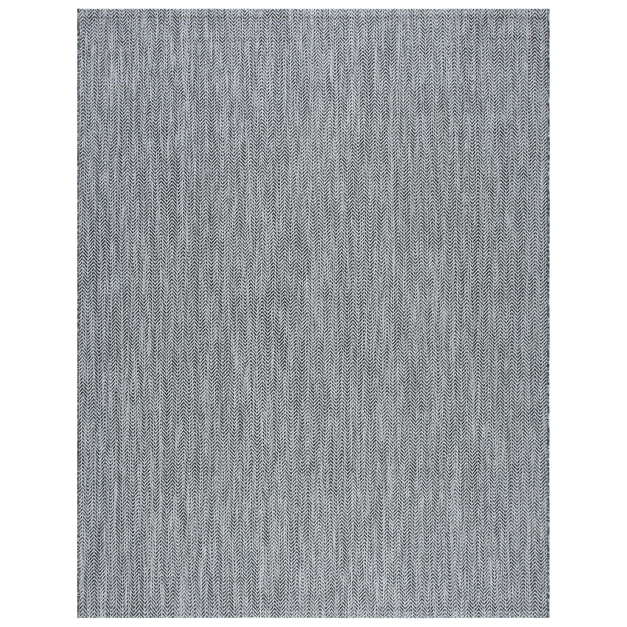 Courtyard Collection 54" Round Black/Beige Synthetic Area Rug