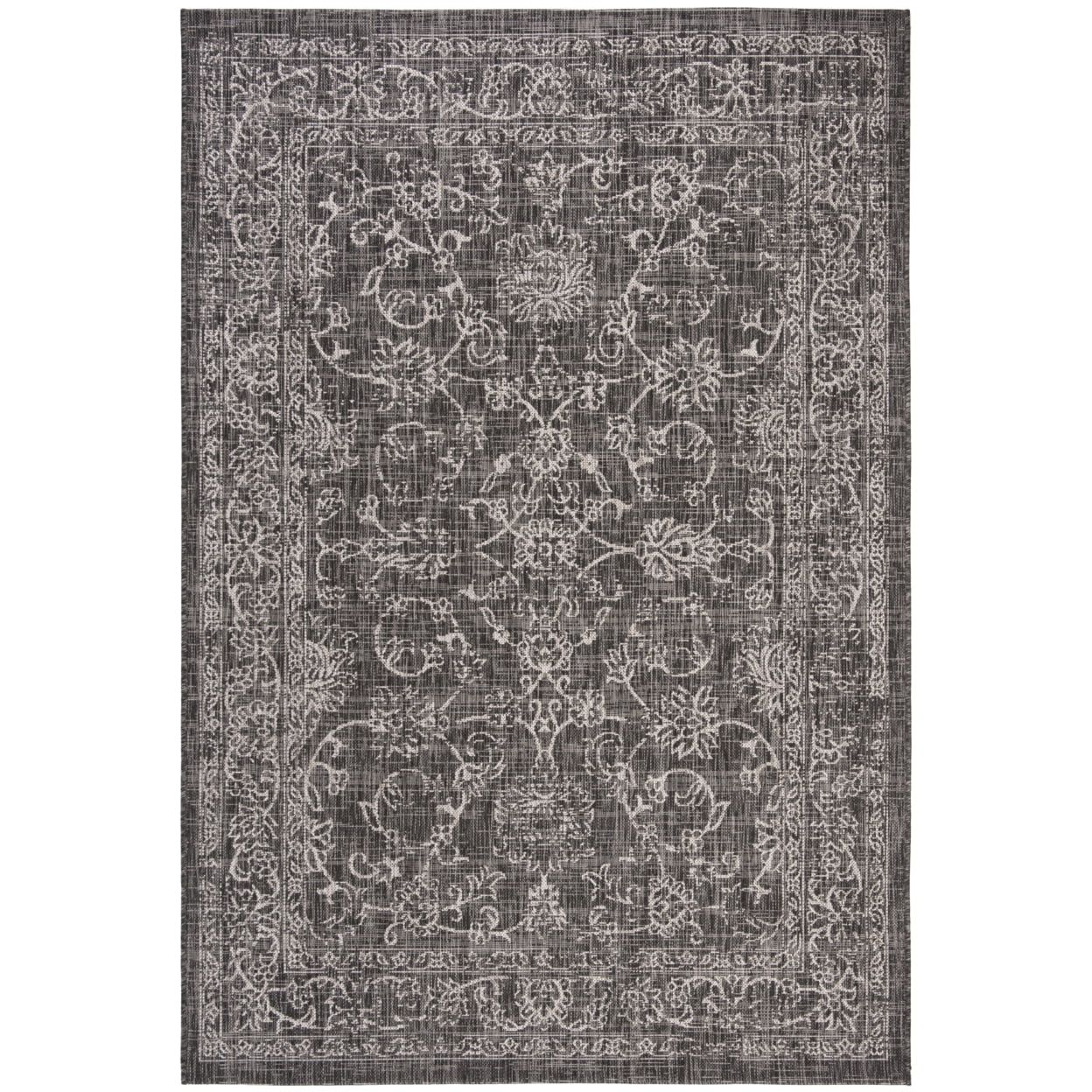 Reversible Black/Ivory Synthetic 9' x 12' Easy-Care Area Rug