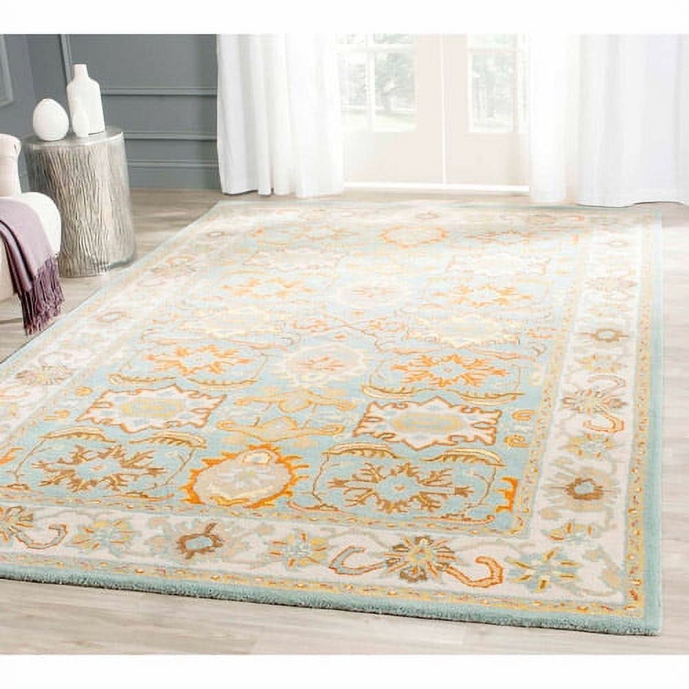 Hand-Tufted Light Blue and Ivory Wool 6' x 9' Area Rug
