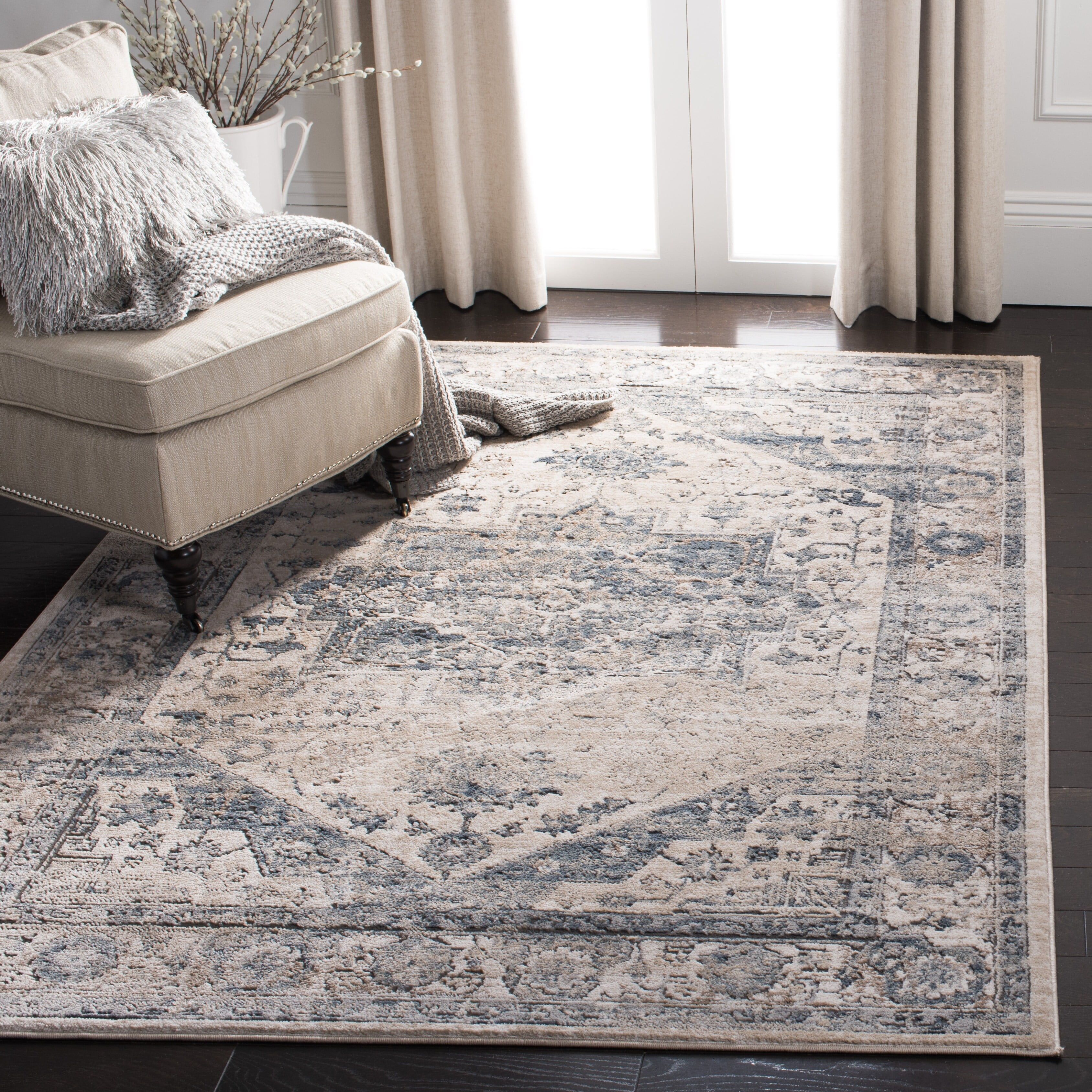 Ivory and Blue Floral Medallion 9' x 12' Synthetic Area Rug