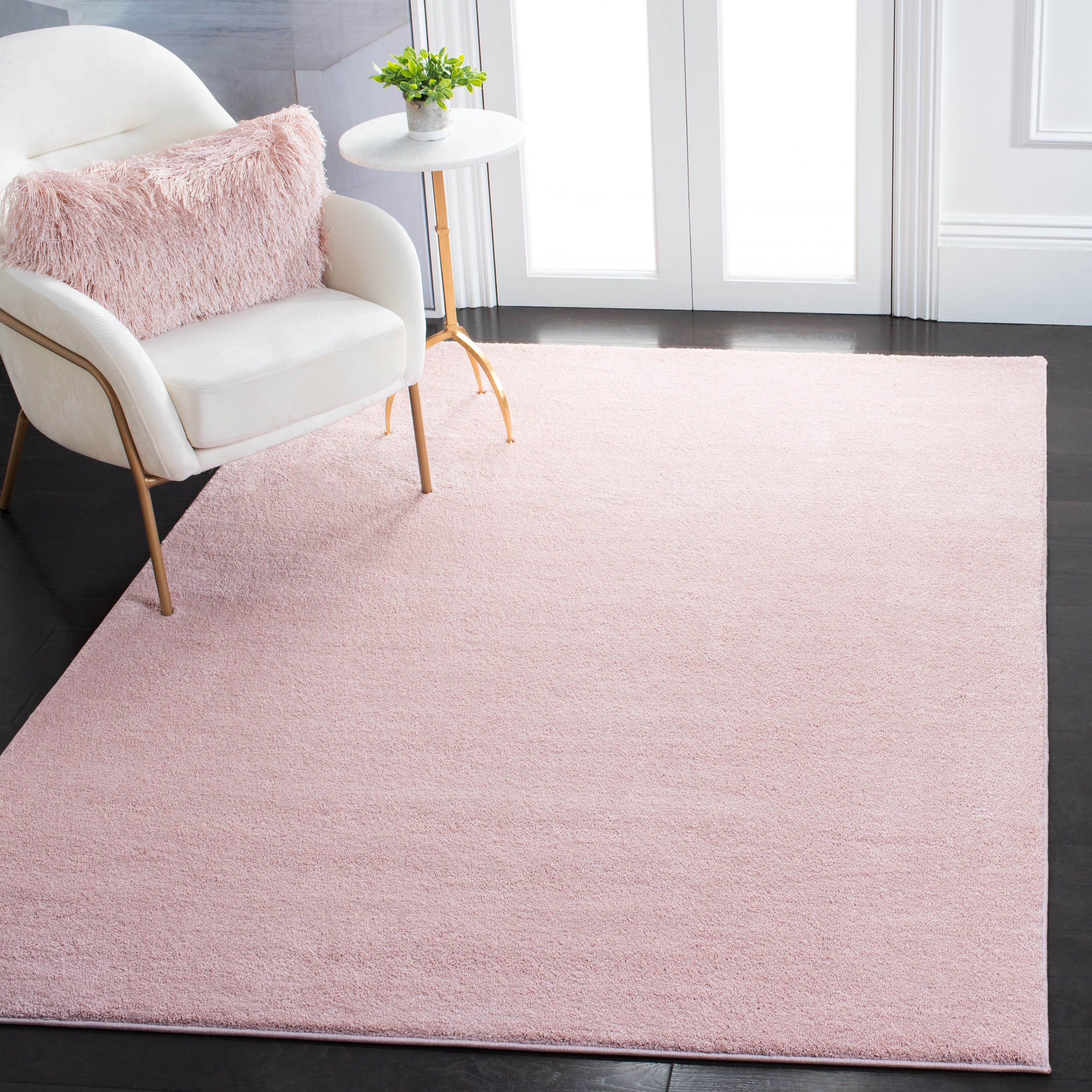 Chic Minimalist Pink Round Synthetic Area Rug, 5'5" x 7'7"