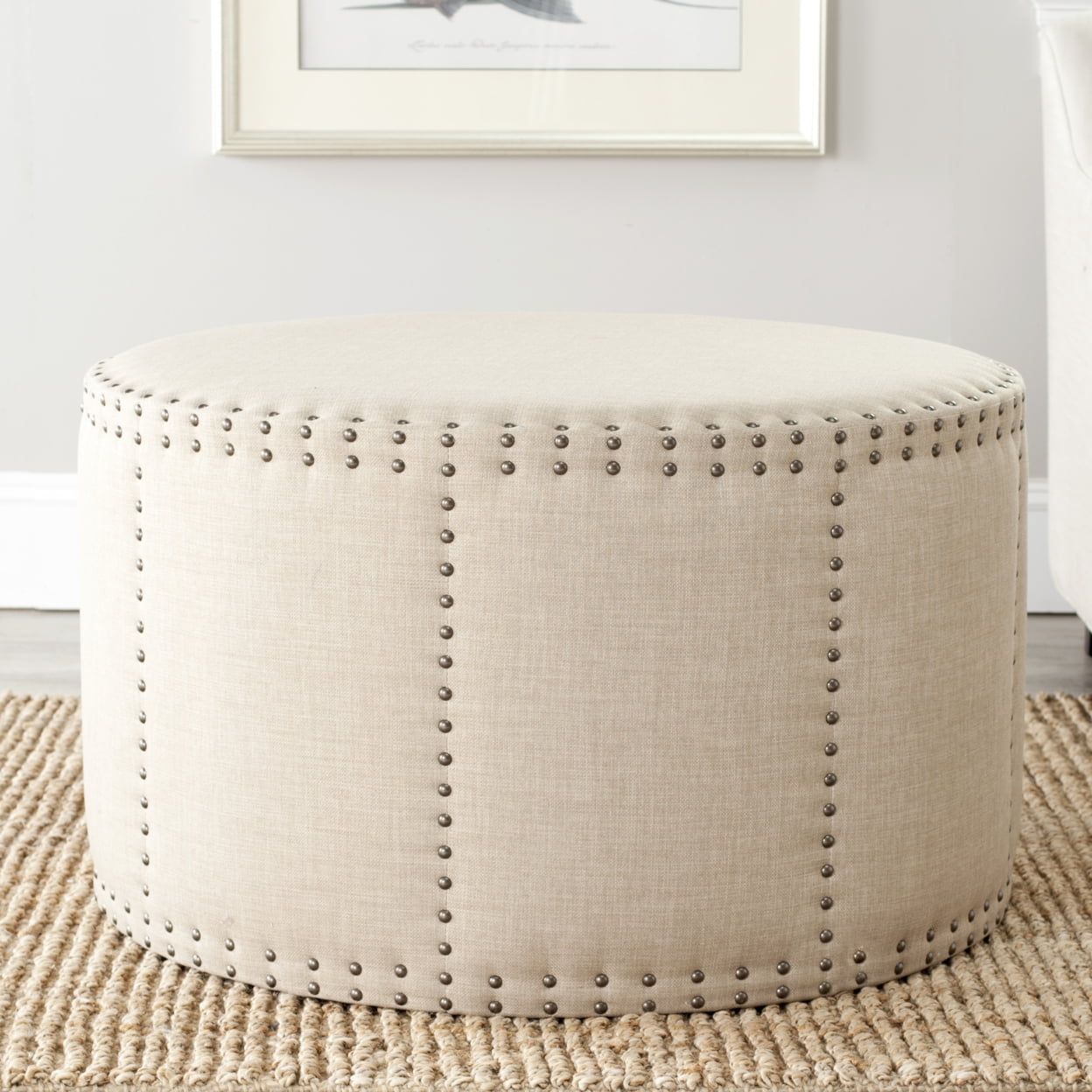 Transitional 34'' Round Beige Linen-Blend Cocktail Ottoman with Brass Nail Head