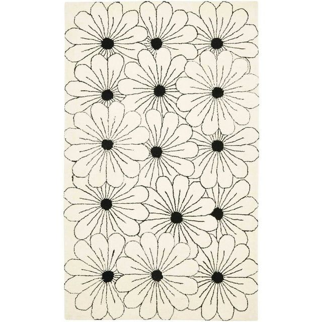 Ivory and Black Tufted Wool Floral 5' x 8' Area Rug