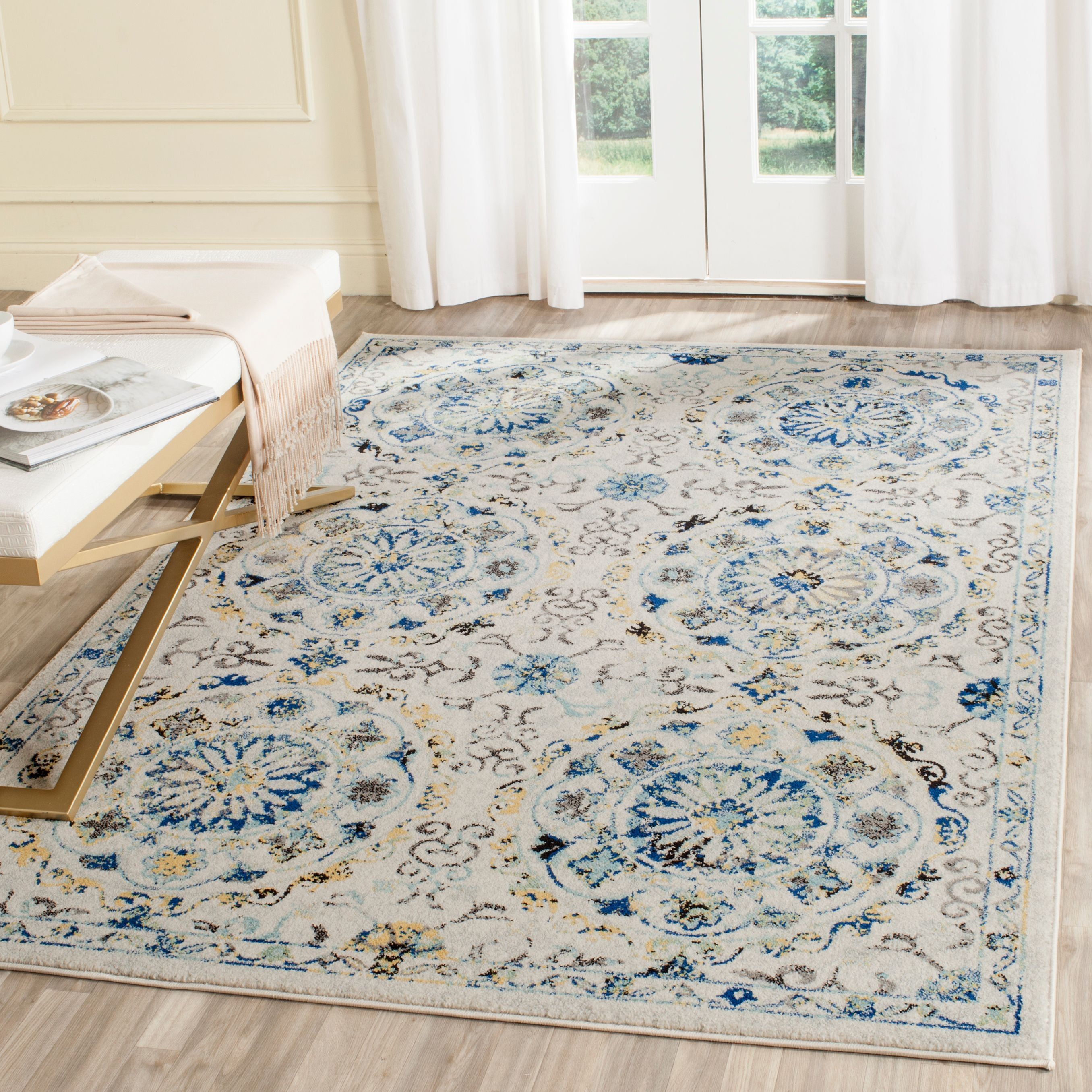 Ivory and Blue Floral Motif Synthetic Area Rug