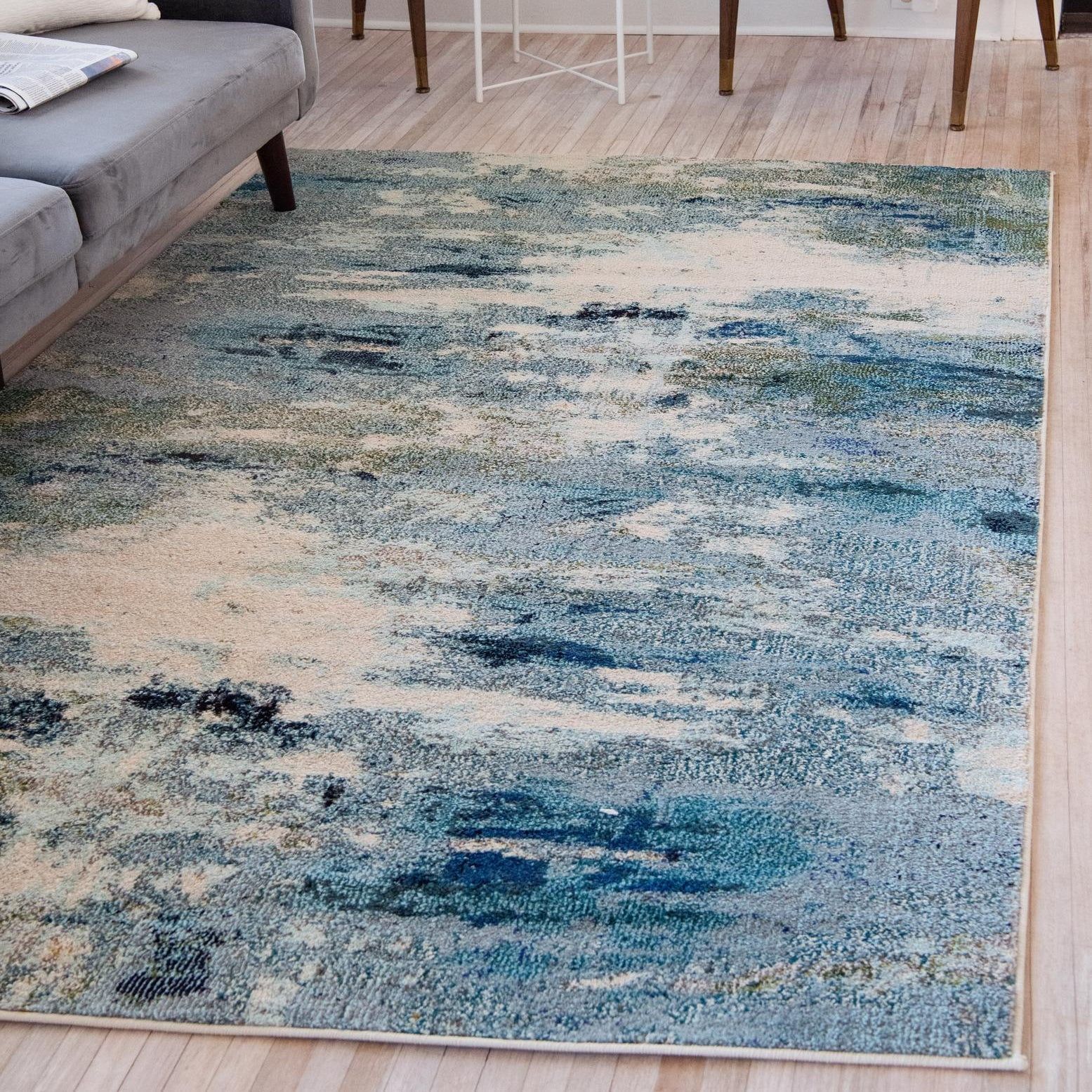 Light Blue and Beige Abstract Synthetic 4' x 6' Area Rug