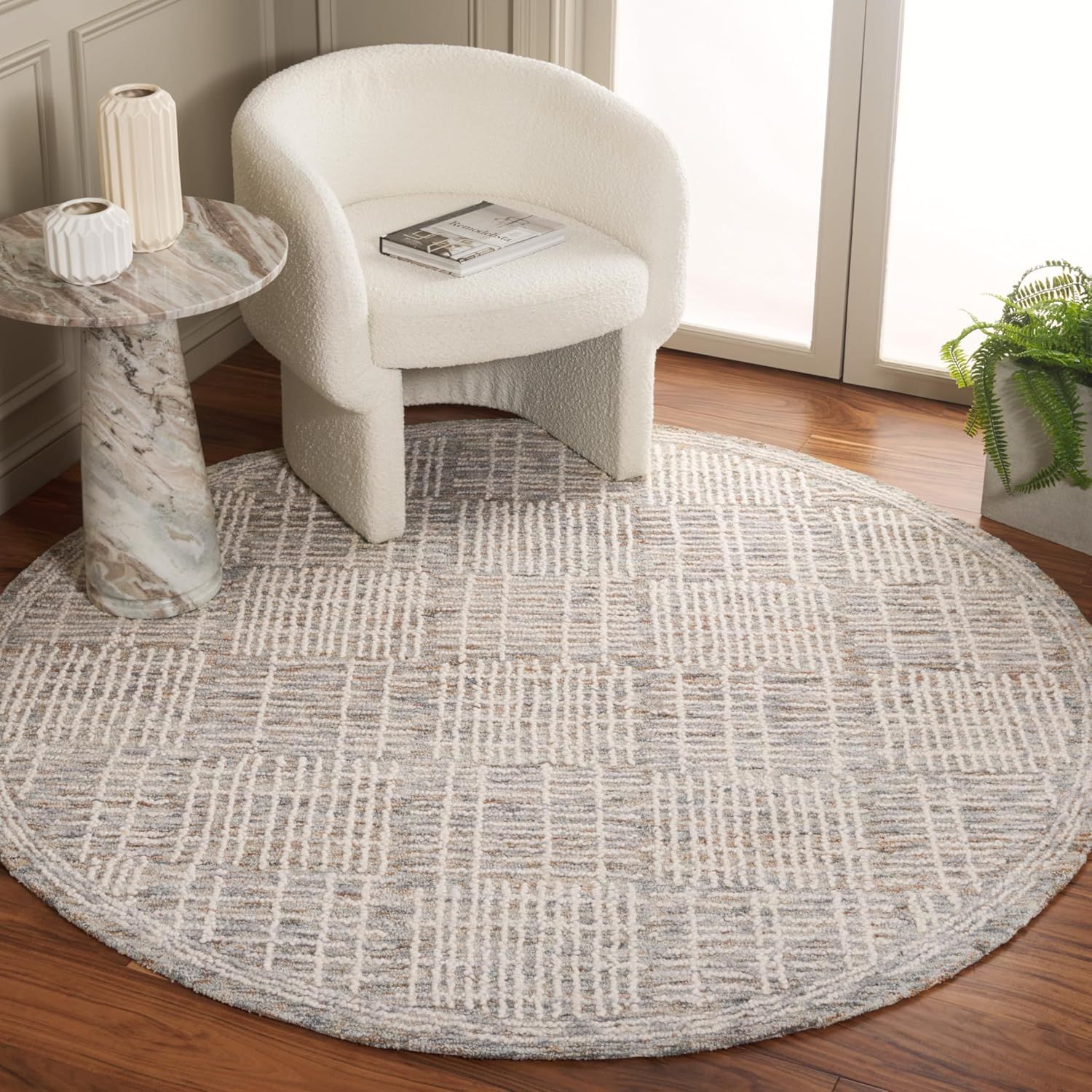 Handmade Round Brown and Ivory Wool Abstract Rug