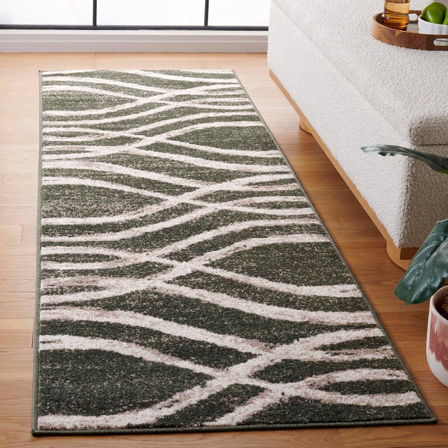 6' x 9' Dark Green and Ivory Synthetic Rectangular Rug