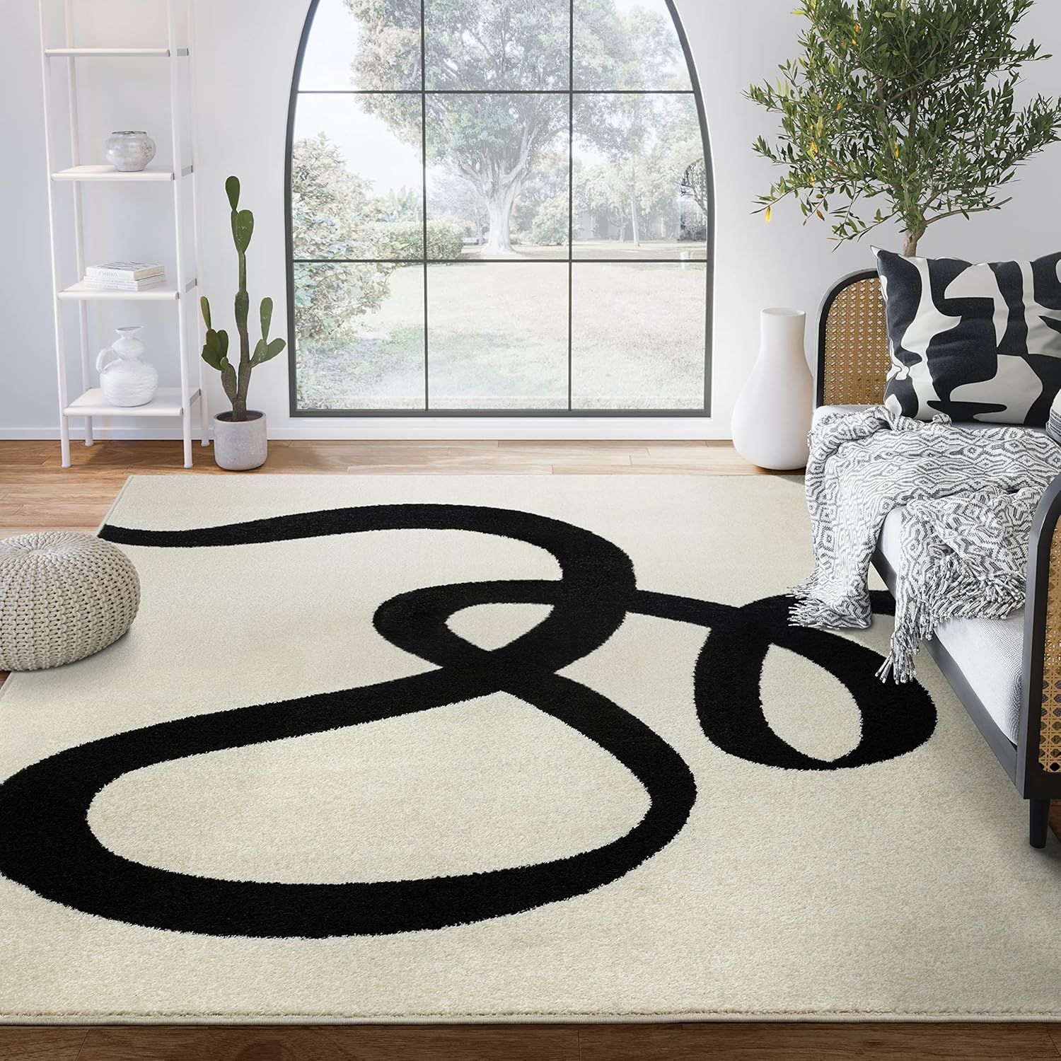 6' x 9' Black and Beige Abstract Rectangular Rug