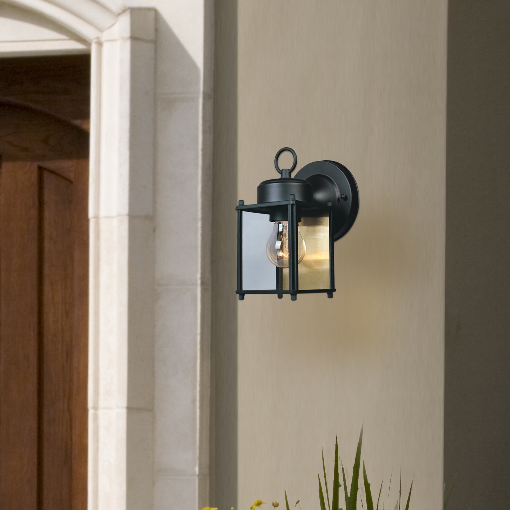 Elegant Black Steel Outdoor Lantern Sconce with Clear Glass