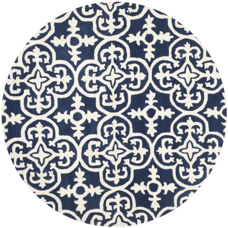 Handmade Round Blue and Ivory Wool Tufted Area Rug