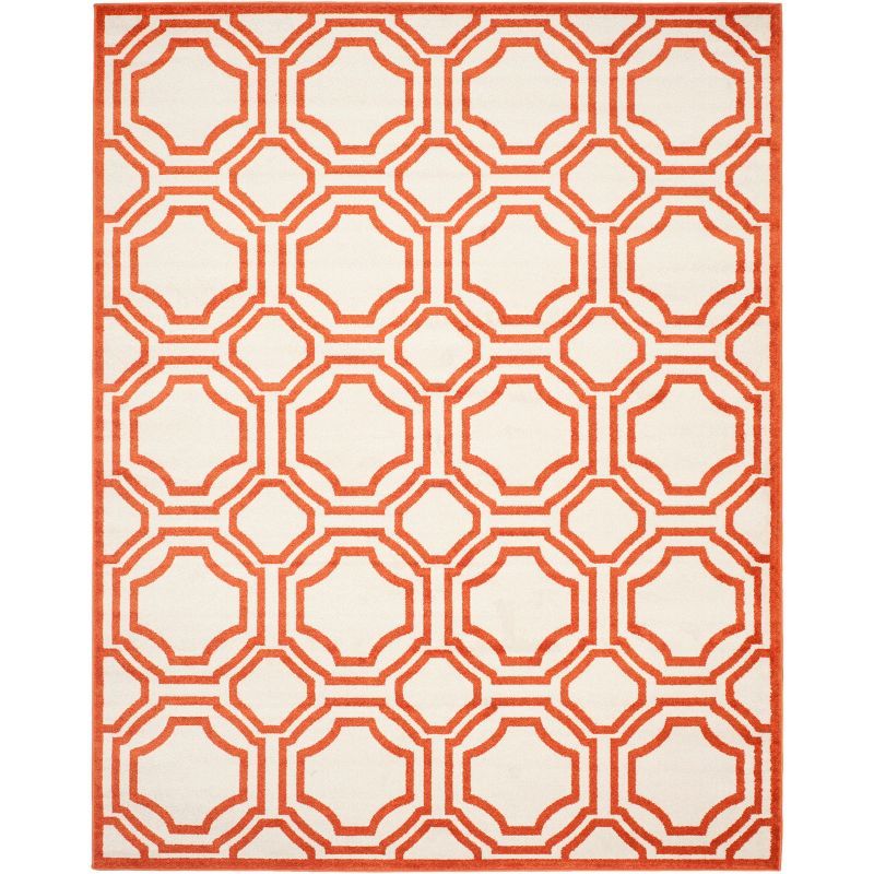 Ivory and Orange Geometric 8' x 10' Stain-Resistant Synthetic Rug