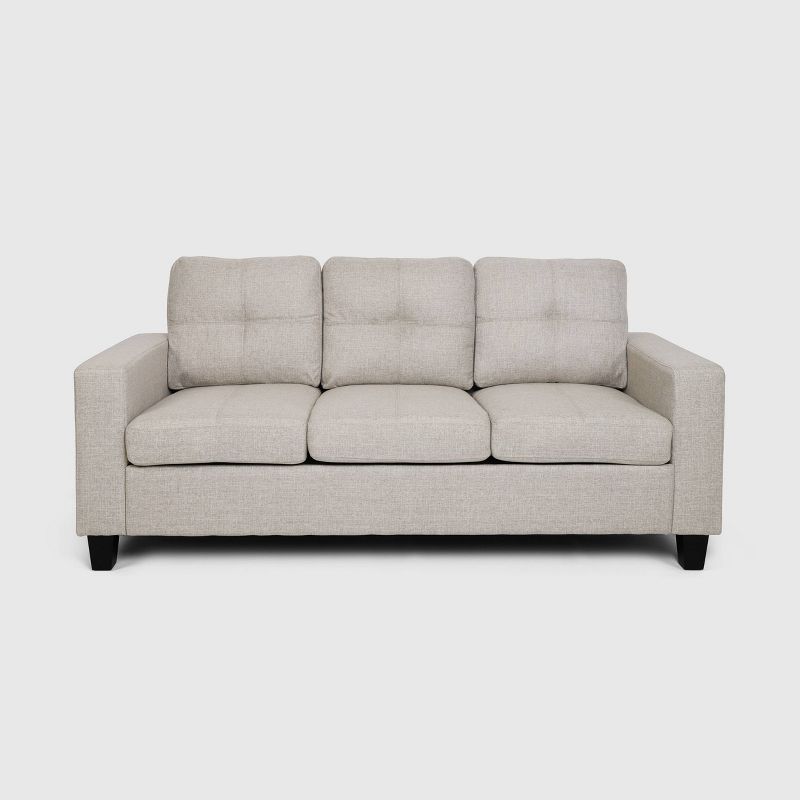 Beige Tufted Fabric Sofa with Natural Wood Legs and Sloped Arms