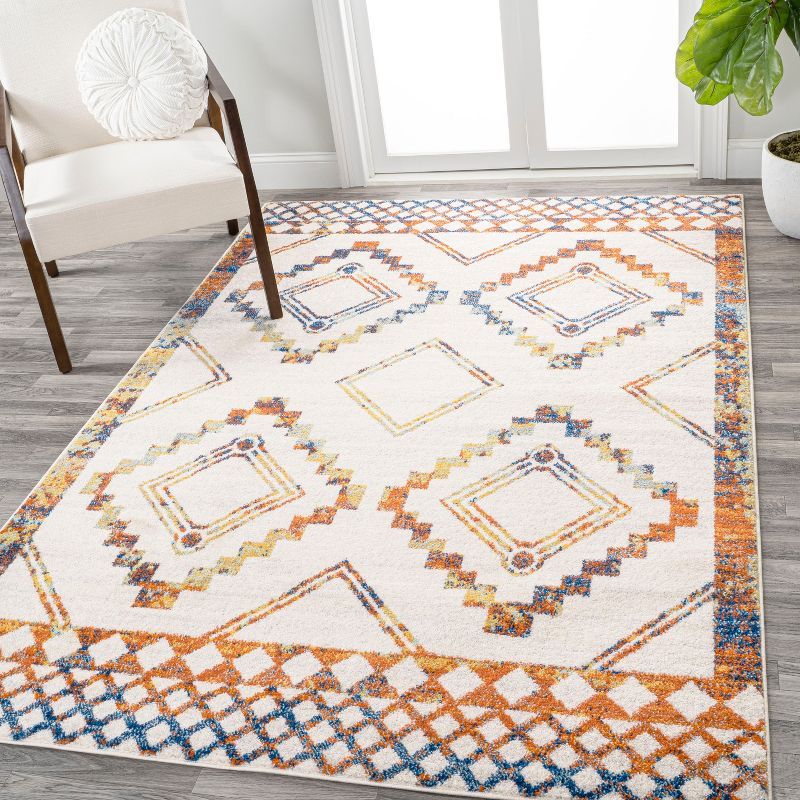 Ivory and Blue Geometric 8' x 10' Synthetic Area Rug