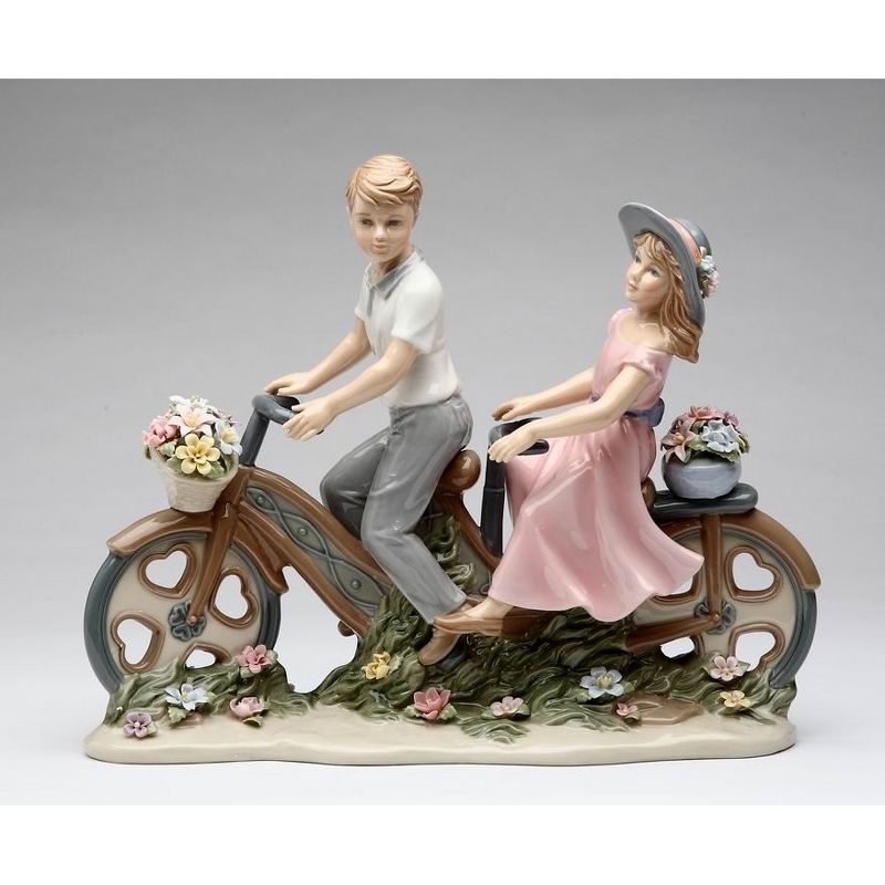 Charming Ceramic Couple on Bicycle Figurine with Floral Details