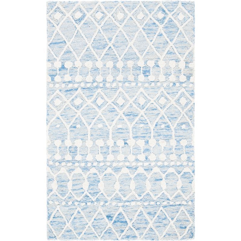 Handmade Blue and Ivory Tufted Wool Floral Rug