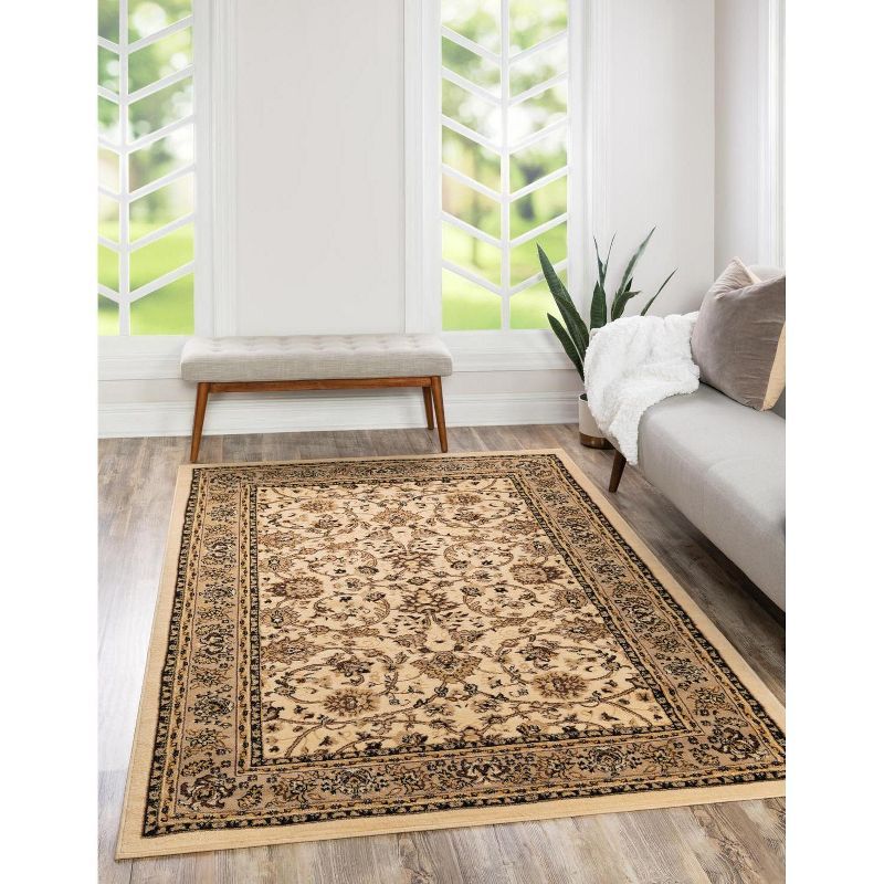 Ivory and Tan 4' x 6' Stain-Resistant Synthetic Area Rug