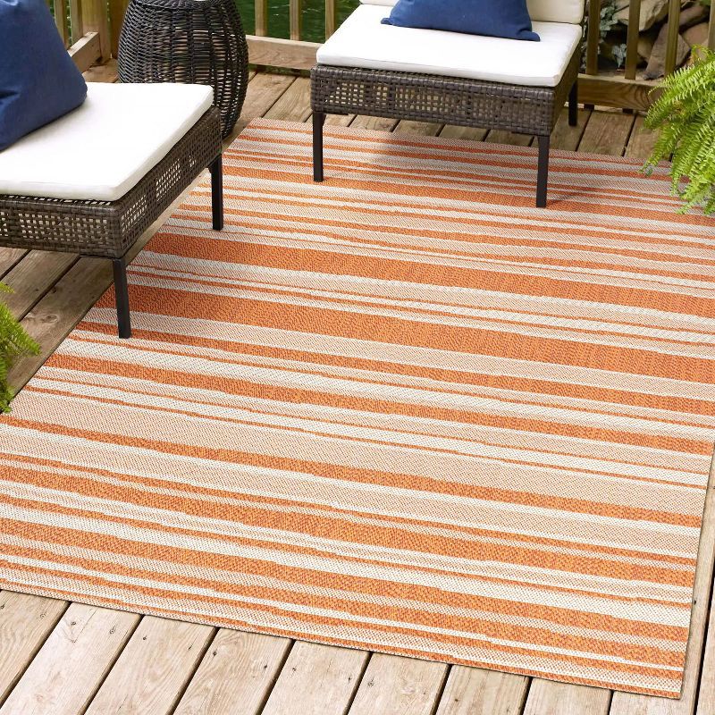 Castara Chic Orange & Cream Striped Synthetic 5x8 Area Rug