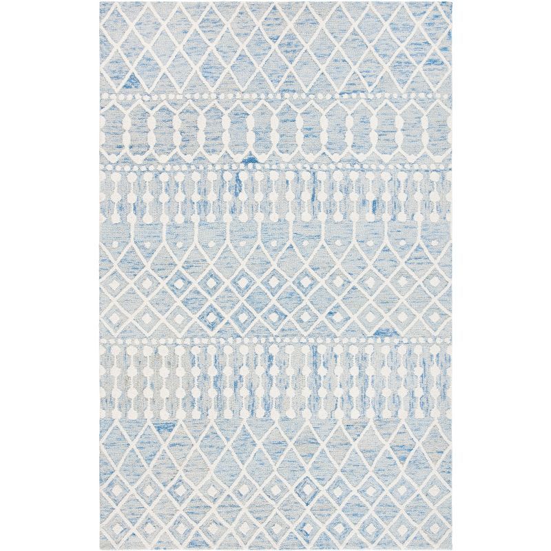 Blue and Ivory 6' x 9' Hand Tufted Wool Floral Area Rug