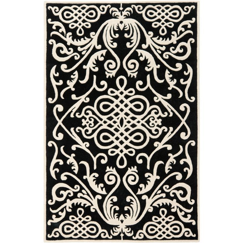 Handmade Black and Ivory Wool Viscose Tufted Area Rug