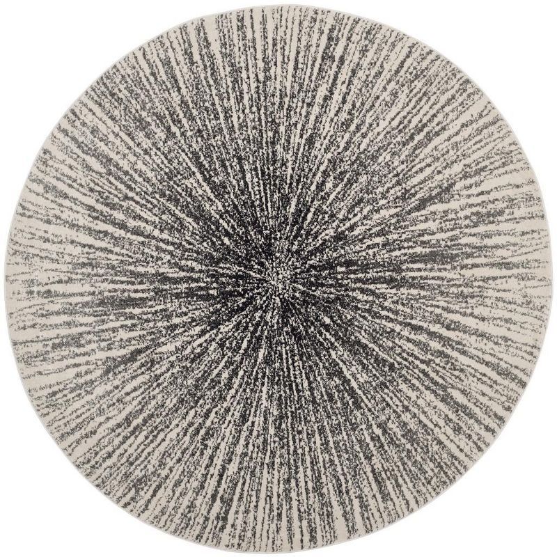 Evoke 9' Round Black and Ivory Synthetic Area Rug