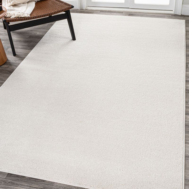 Cream Solid Synthetic Low-Pile Reversible Area Rug 8 x 10