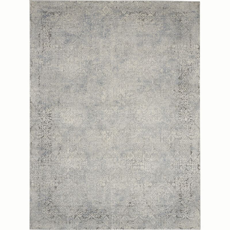 Ivory and Light Blue Abstract Synthetic 8' x 11' Area Rug
