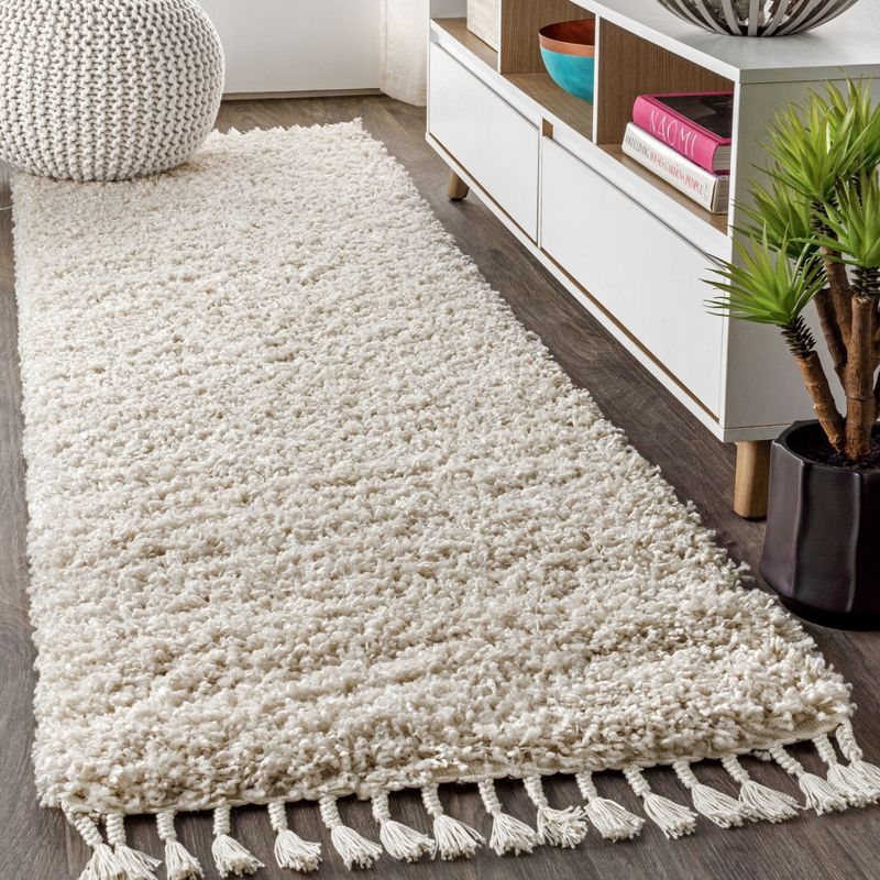 Cream 2 x 8 Shag Reversible Synthetic Area Rug with Tassels