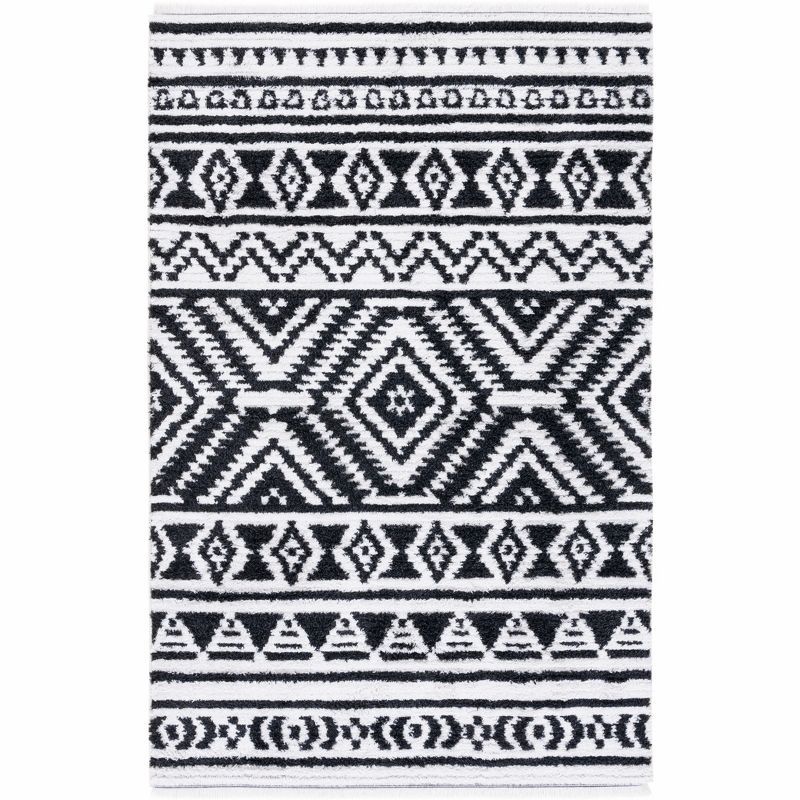 Nomadic Boho-Mod Black & Ivory Synthetic Area Rug - 6'4" x 9'6"