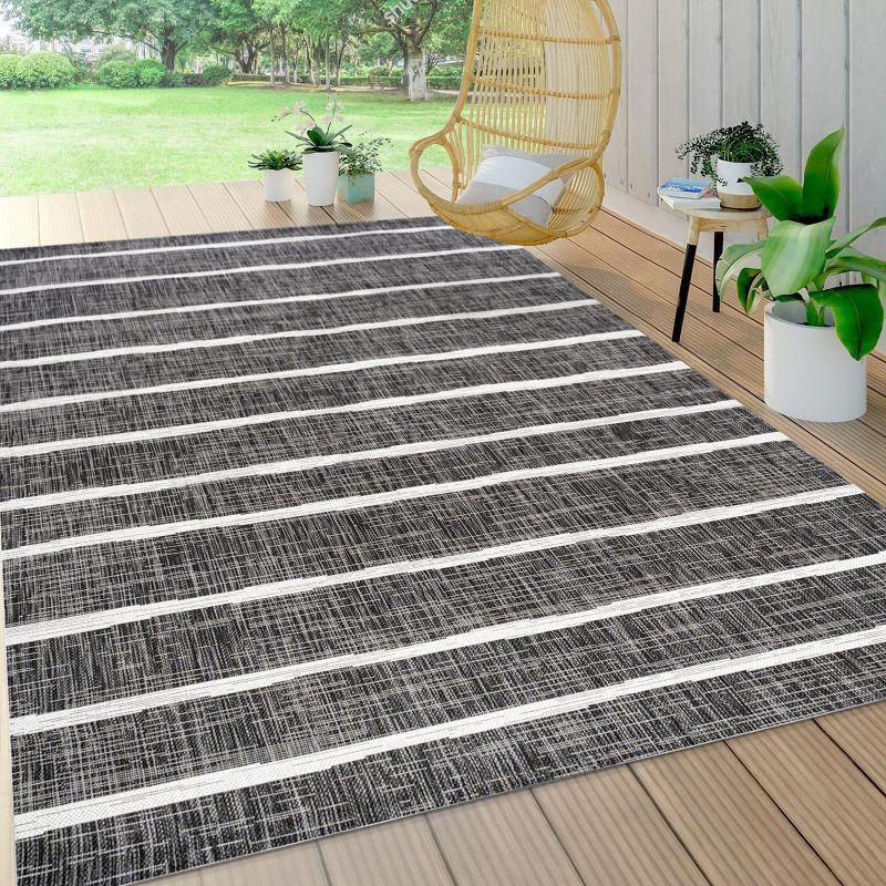 3' x 5' Black and Ivory Synthetic Stripe Rectangular Rug