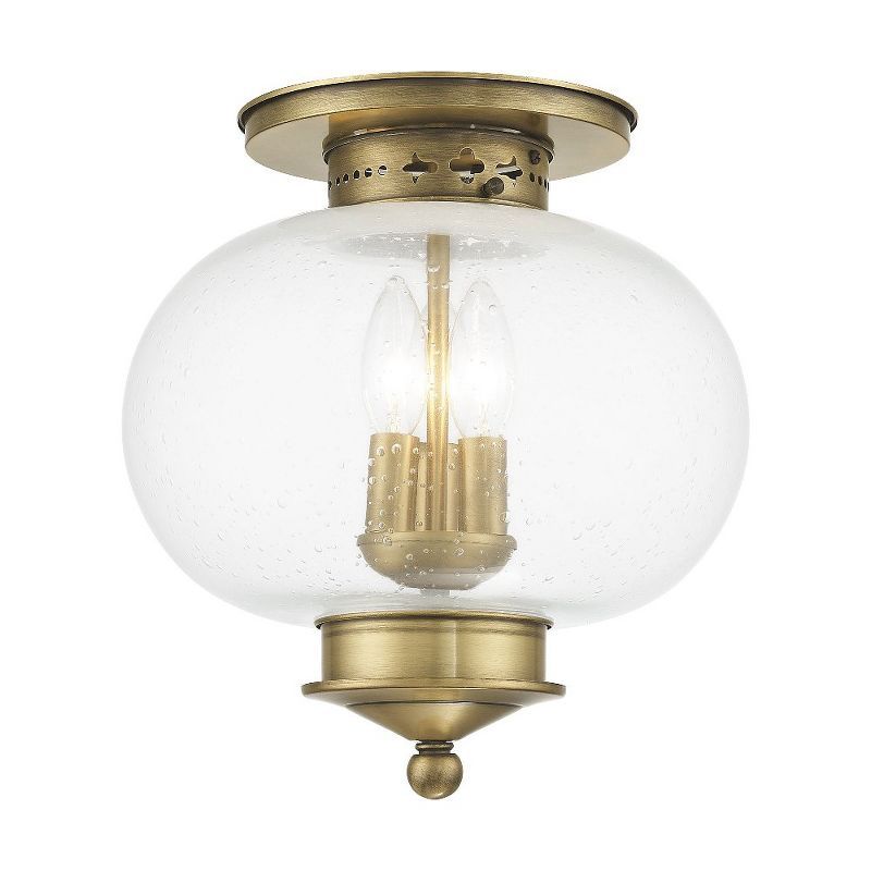 Harbor Antique Brass Globe LED Flush Mount with Hand Blown Seeded Glass