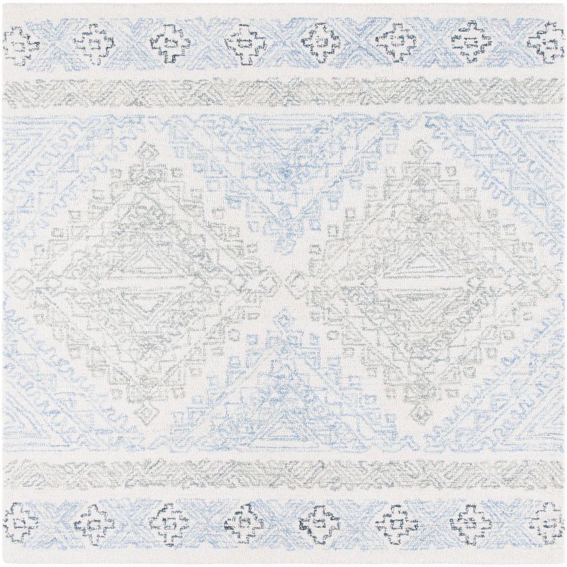 Off-White and Blue Round Tufted Wool Area Rug