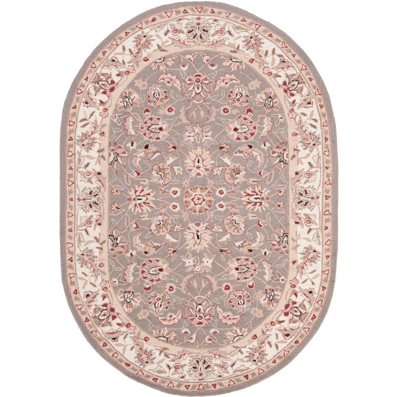 Handmade Taupe and Ivory Oval Wool Area Rug 4' x 6'