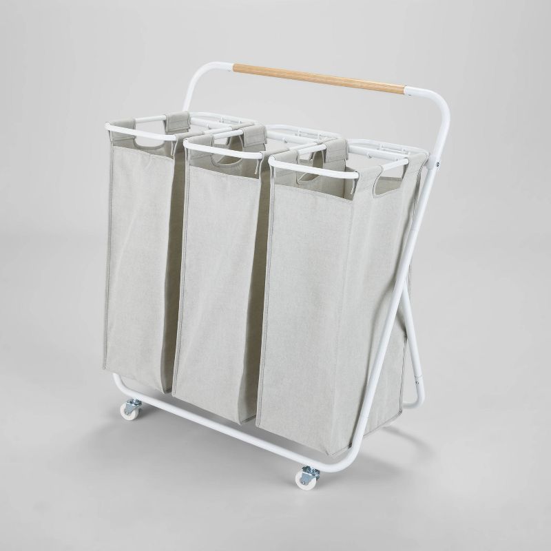 White Triple Compartment Rolling Laundry Sorter with Wood Handle