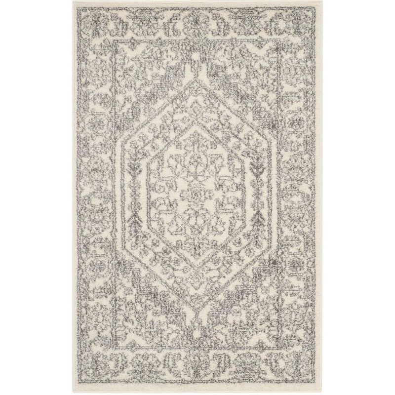 Ivory and Silver Medallion Synthetic Area Rug 2'6" x 4'