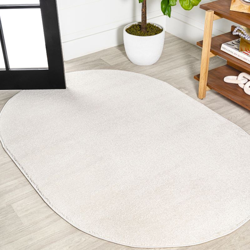 Cream Oval Low-Pile Synthetic Indoor Area Rug